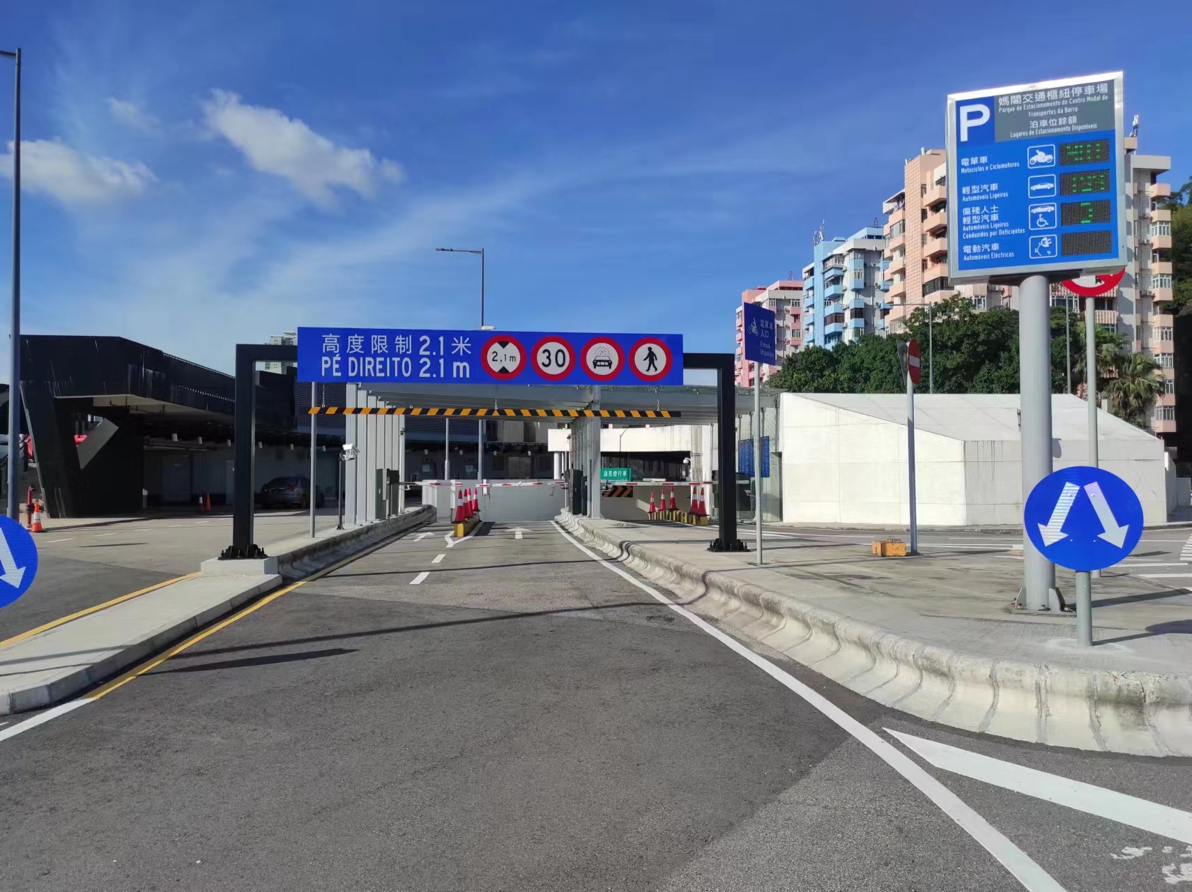 Entrance and exit of the light vehicle and motorcycle parking lot
